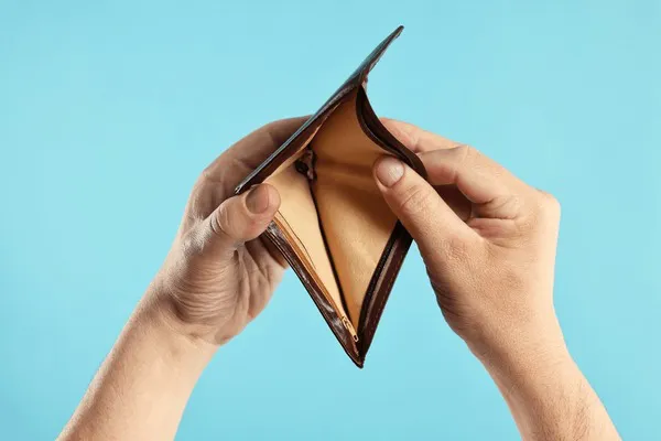 man-empty-wallet-on-light-600nw-2495203791