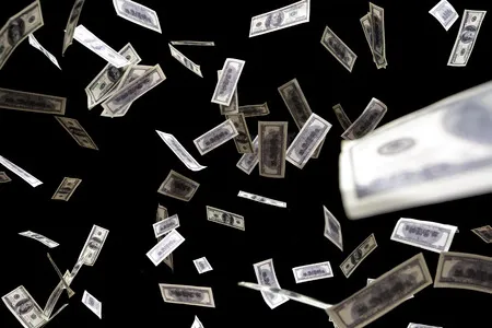 70570574-cien-dólares-billetes-vuelan-sobre-fondo-negro-el-concepto-de-dinero-lluvia