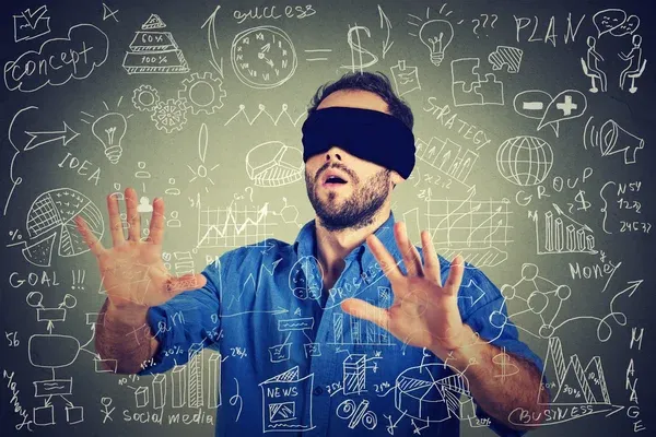 depositphotos_90538898-stock-photo-blindfolded-young-business-man-searching