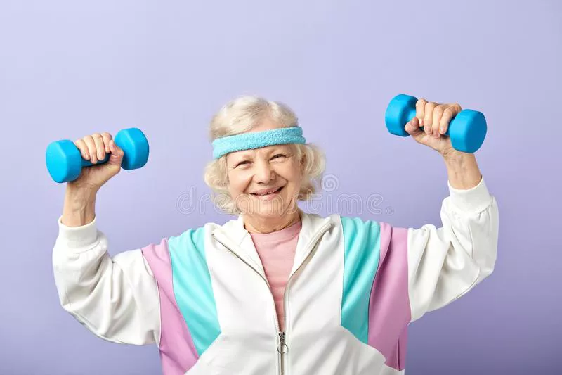 cheerful-elderly-woman-exercising-pair-dumbbells-smiling-vital-senior-grandma-dressed-stylish-sports-suit-149179138