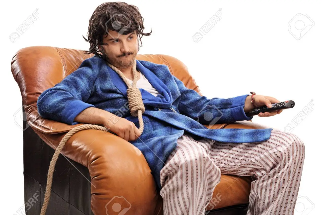 58307068-bored-young-man-watching-tv-and-changing-channels-with-a-rope-around-his-neck-isolated-on-white