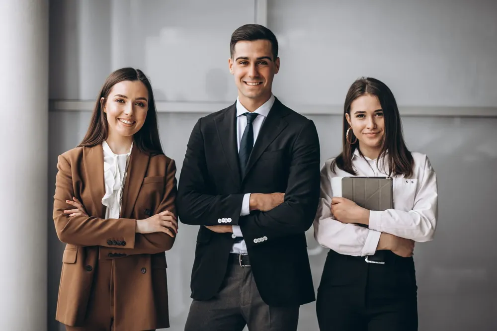 bussiness-people-working-in-team-in-an-office-1-1-scaled